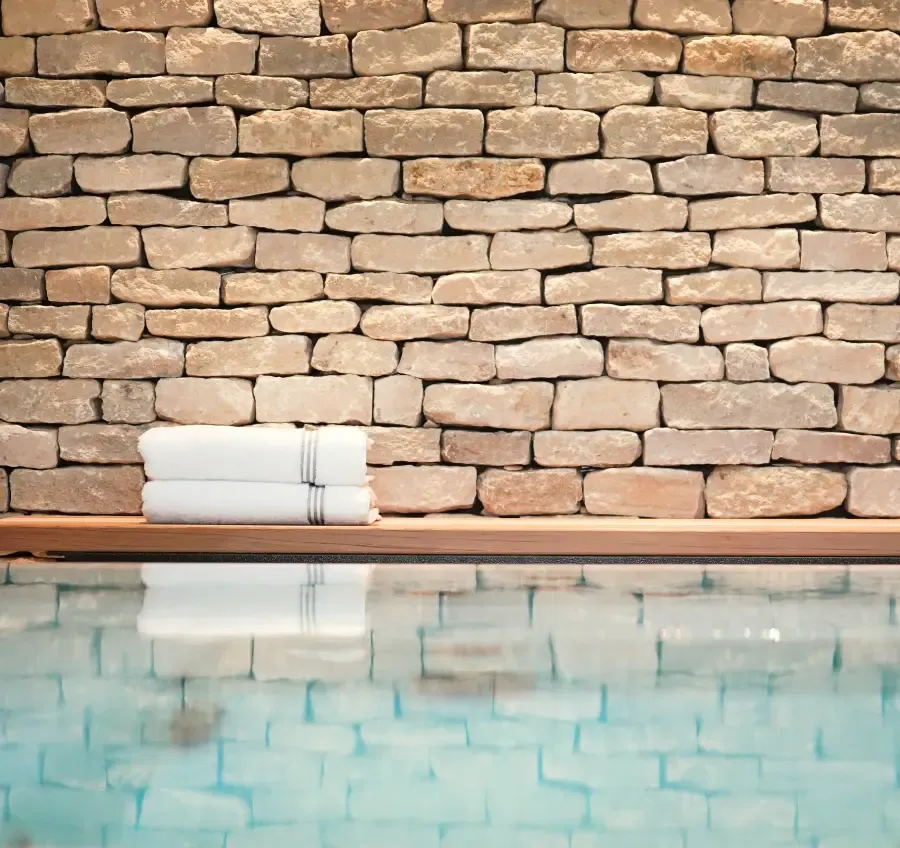 Natural stone wall detail at Homefield Grange spa with hydrotherapy pool and calm wellness retreat setting