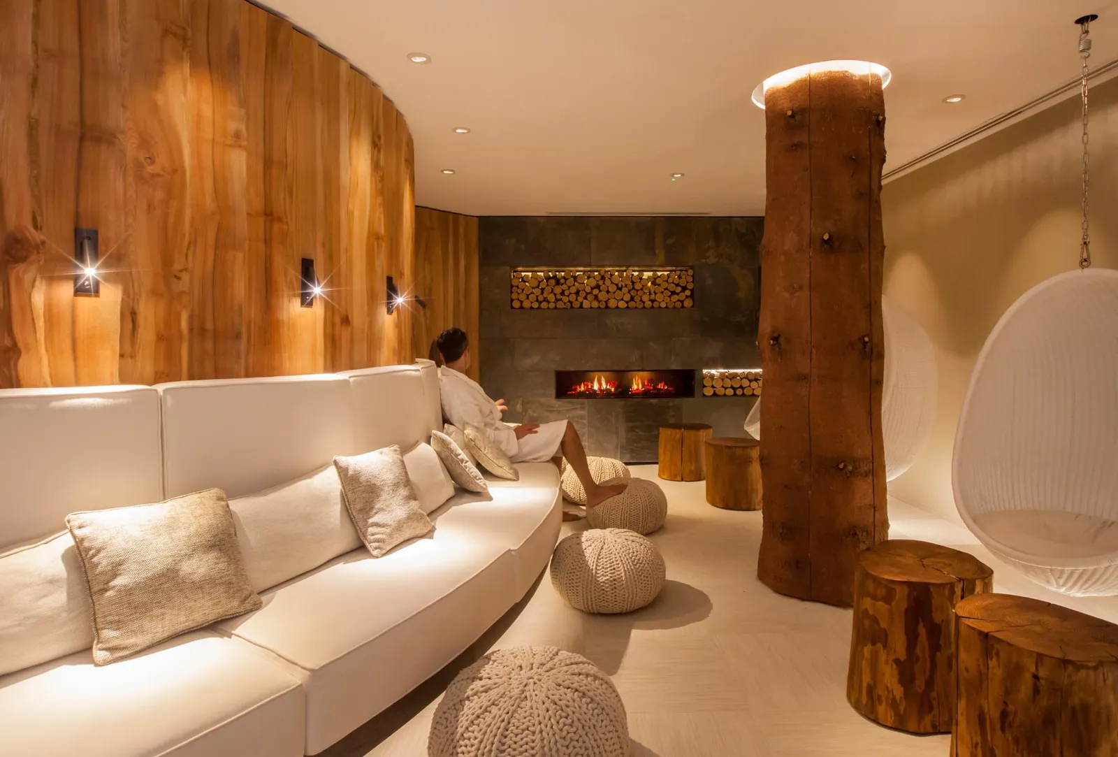 Women relaxing in loung of natural stone and timber finishes reflecting forest setting at Champneys Forest Mere spa