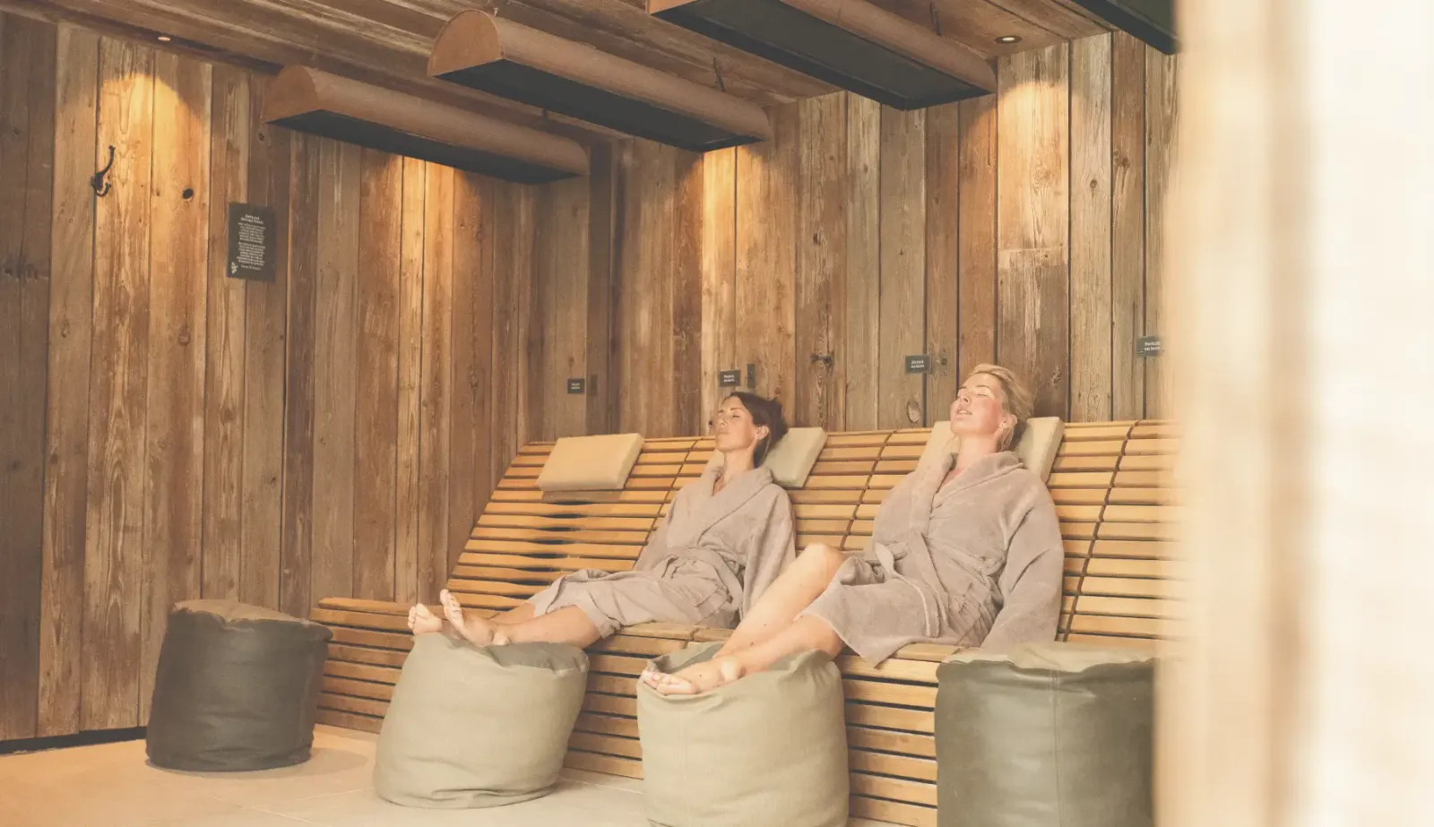 Infrared therapy bench within thermal spa at Homefield Grange, showing timber interior and relaxation space