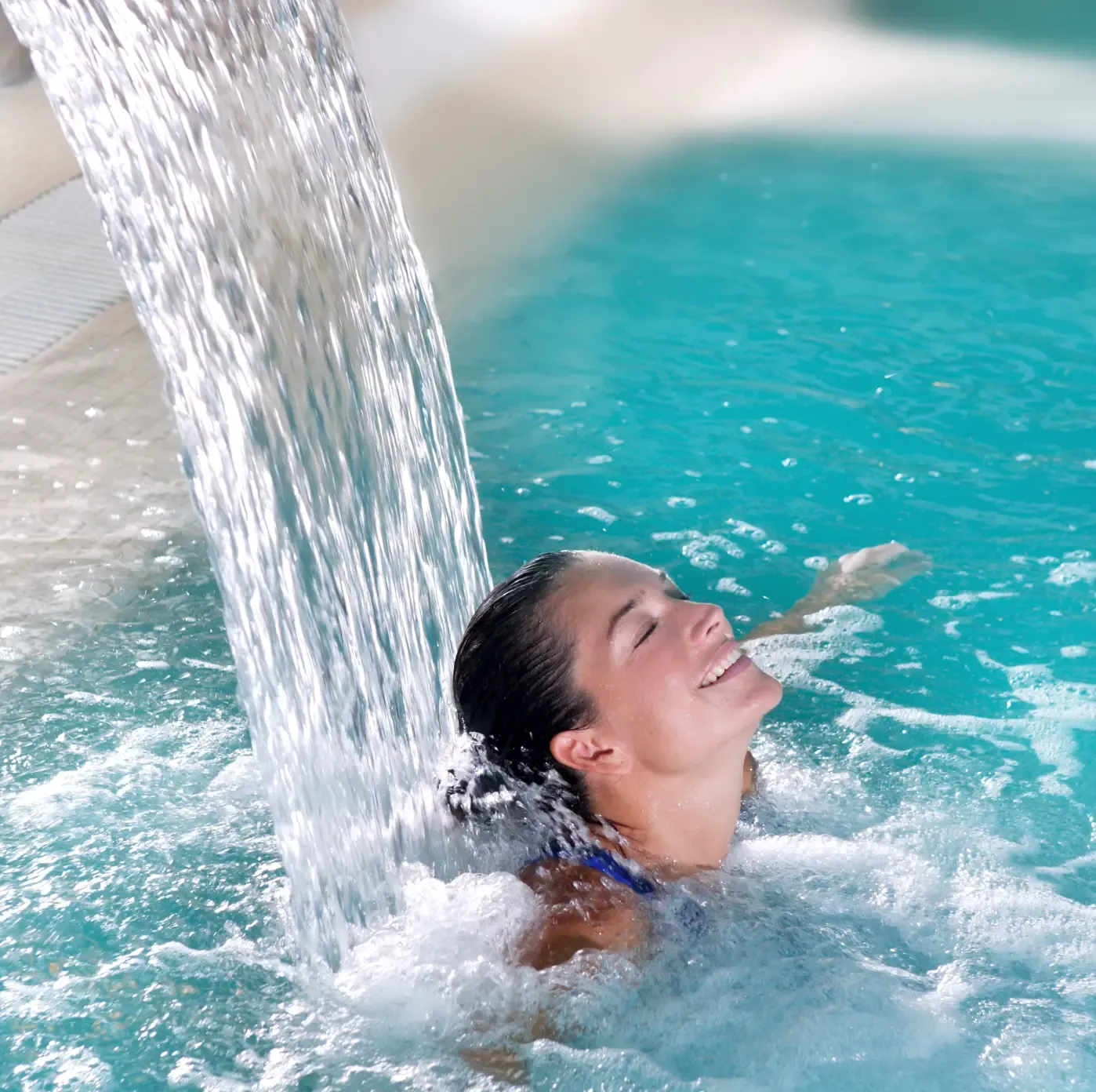 Women using bespoke hydrotherpy pool design massage feature