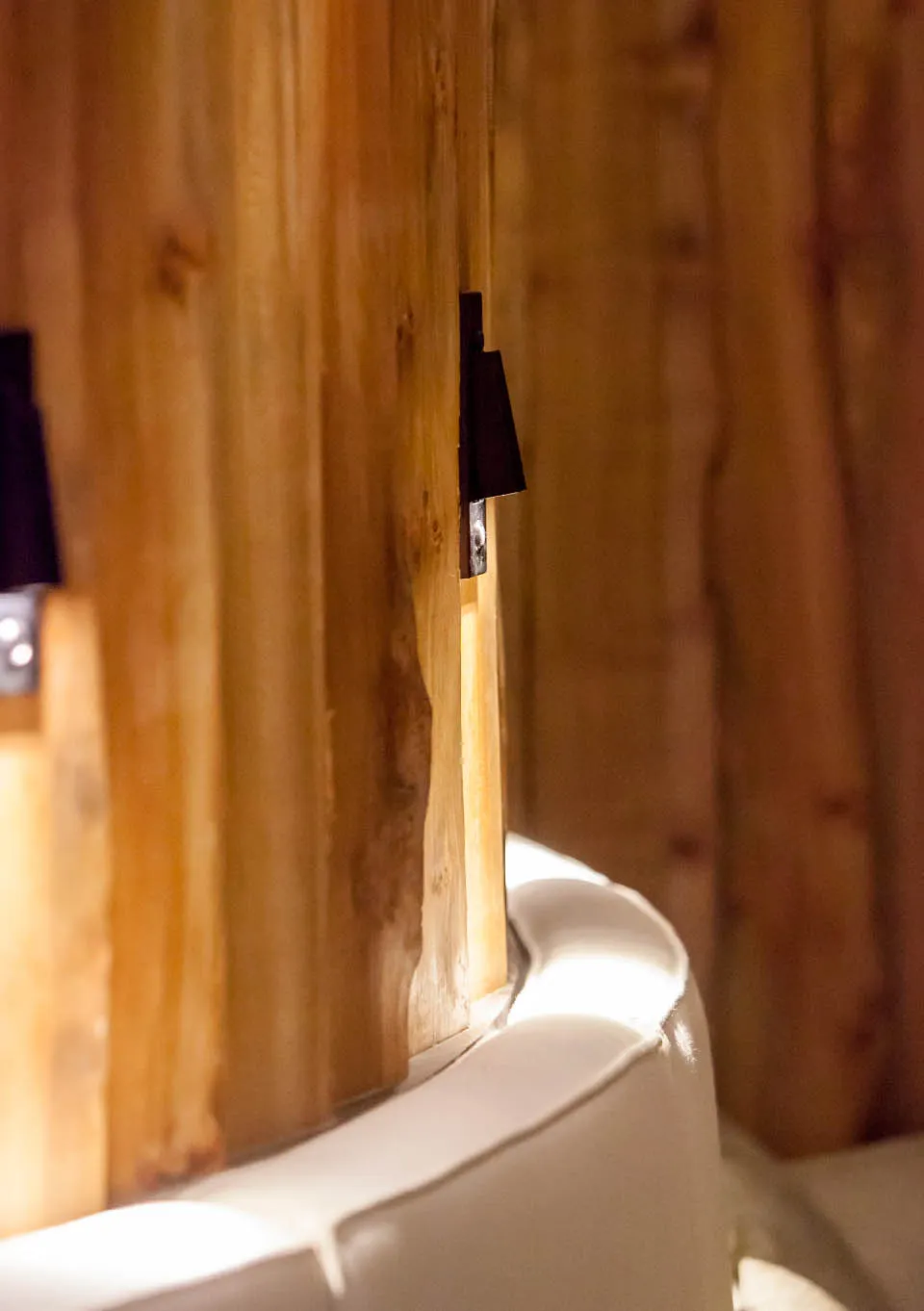Rustic wayney edge wall panelling inspired by woodland textures in spa interiors