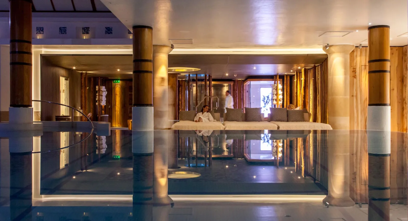 Swimming pool with timber clad columns to integrate with Champneys Thermal Suite in the background