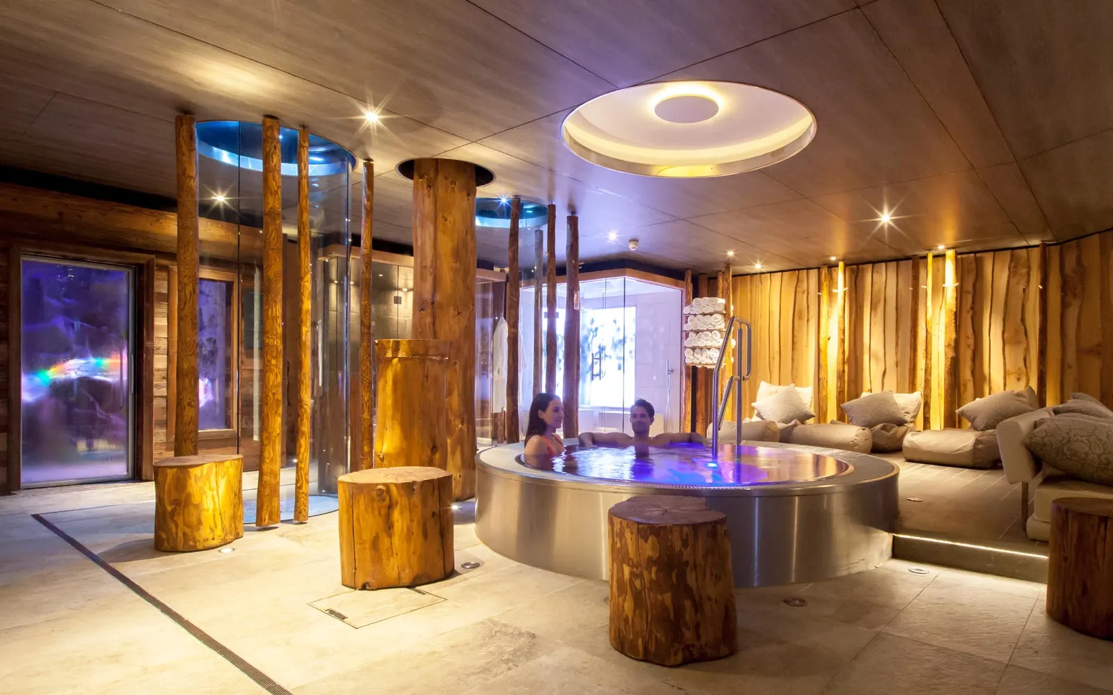 Luxury woodland Jacuzzi bath overlooking forest interior landscape at Champneys Forest Mere